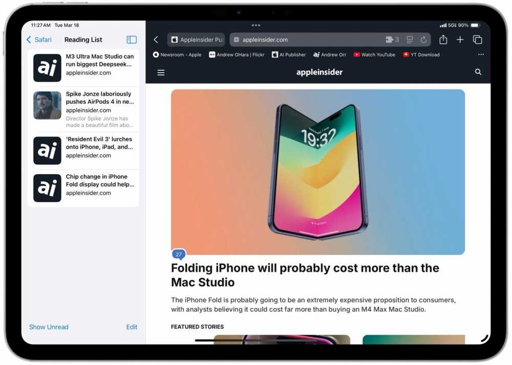 iPad 屏幕显示一个网站，其中包含一篇关于折叠 iPhone 的文章，其中包含该设备的多彩概念图像。