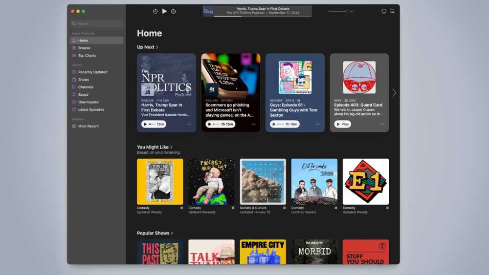 Apple Podcasts interface showing recommended podcasts under Home, Up Next, and You Might Like sections. Categories include Comedy, Society & Culture, and Town Podcast.
