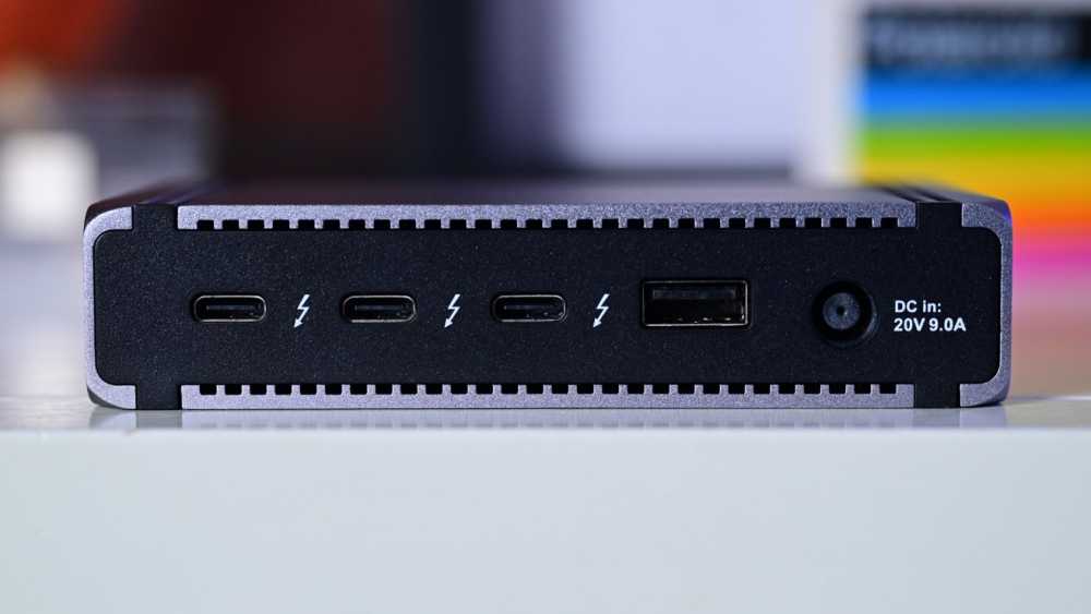 A rectangular electronic device featuring three USB-C ports, one USB-A port, and a DC input with '20V 9.0A' labeled beside it.