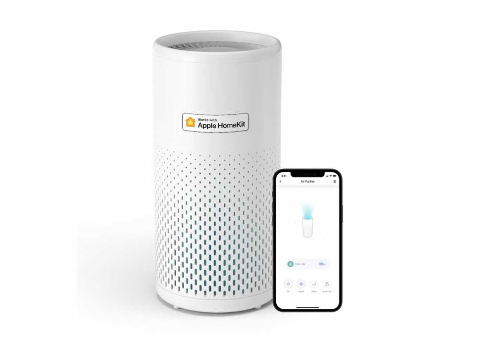 White cylindrical air purifier with perforated design, labeled compatible with Apple HomeKit. A smartphone displaying air purifier controls sits beside it, showing filter life and settings.
