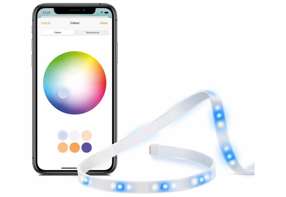 Smartphone displaying color selection app next to a flexible LED light strip glowing with blue and white lights.
