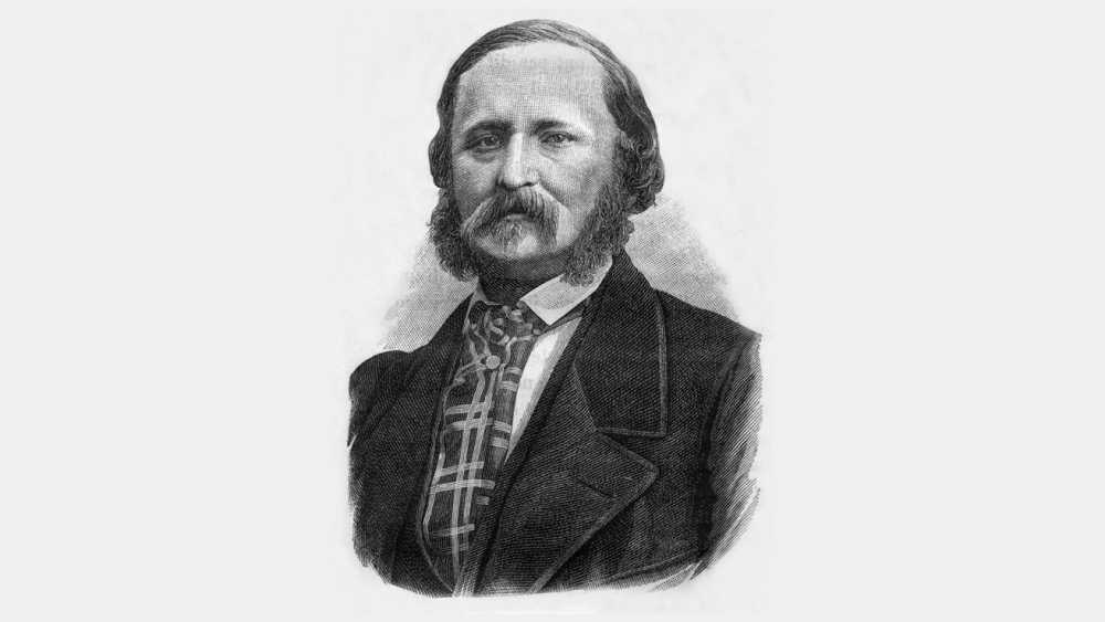 Engraving of a man with a thick mustache, full sideburns, and a suit with a checkered tie against a neutral background.