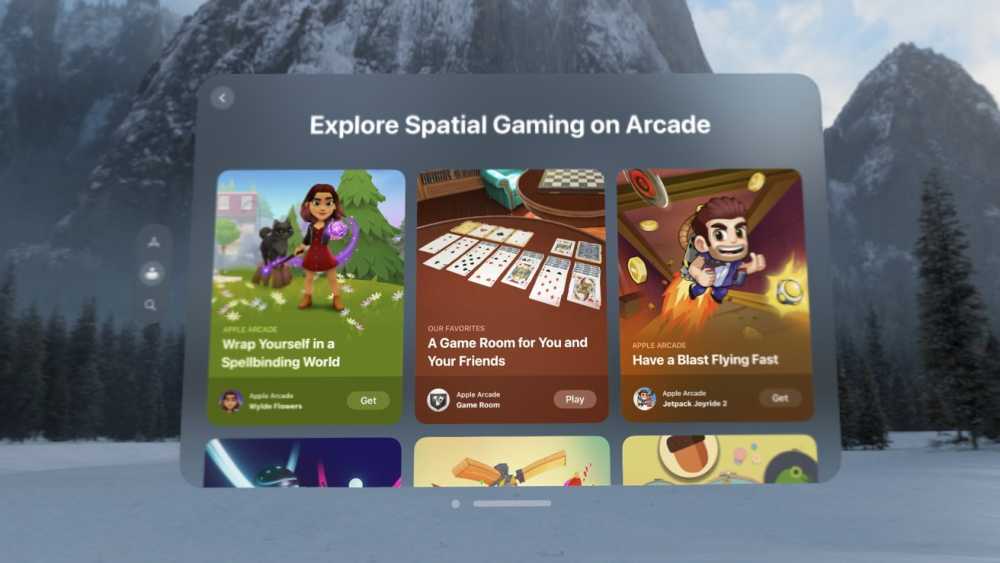 Virtual game menu featuring three games, each card displaying vibrant illustrations. Background shows snowy landscape with mountains and pine trees.