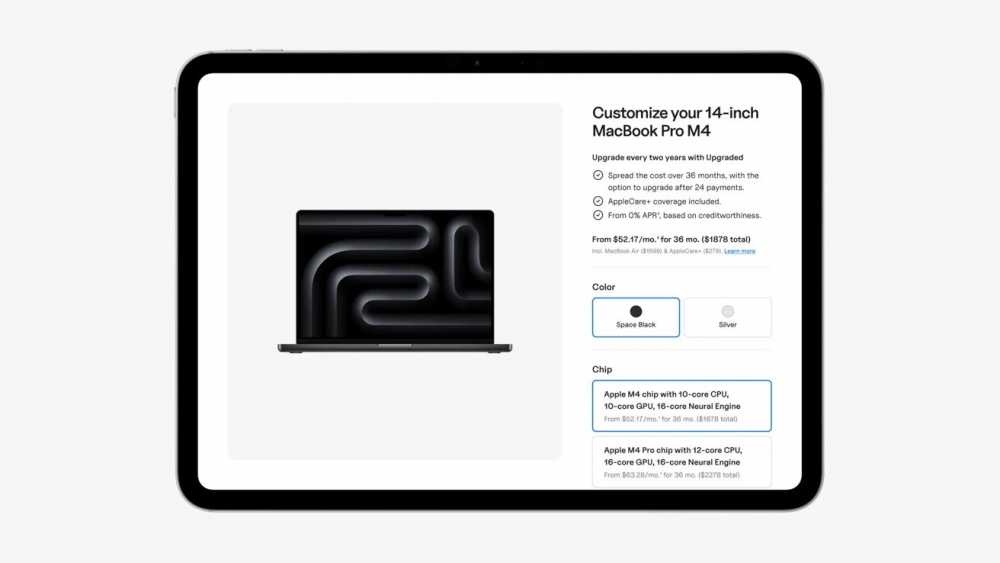Apple iPad displaying a MacBook Pro M4 customization page with upgrade options, color choices, and chip configurations. Black laptop with abstract pattern on screen is shown.