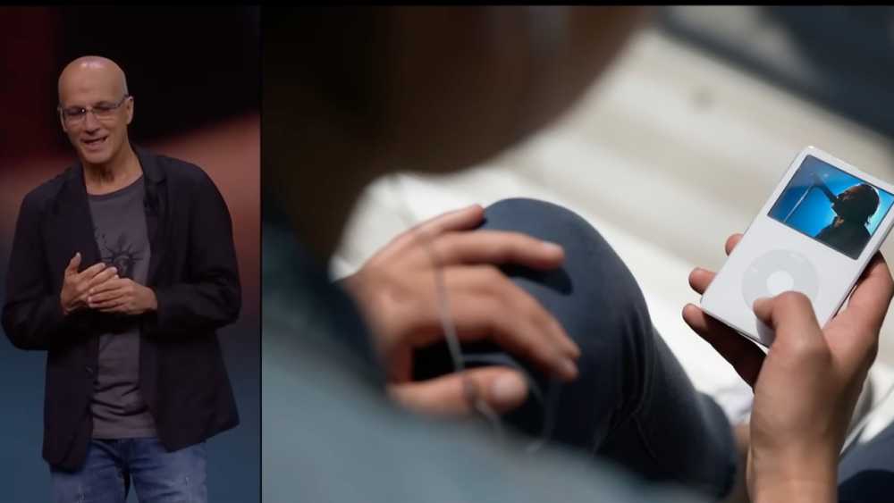 Man speaking on stage, wearing glasses and dark clothing. Close-up of person holding an iPod, watching a video of a singer with a microphone.