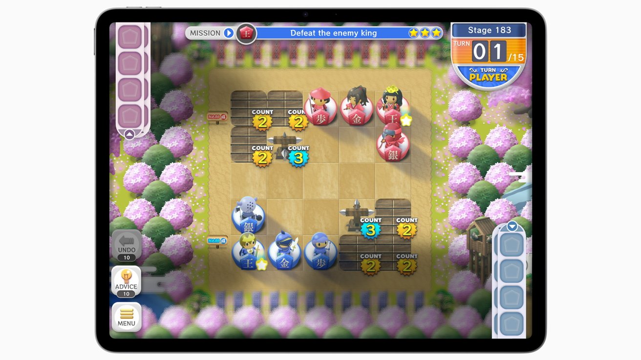 Colorful digital board game with pink and blue character pieces on a grid, surrounded by vibrant pink and green trees. A mission to 'Defeat the enemy king' is displayed.